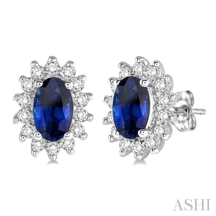 1/5 Ctw Round Cut Diamond and Oval Cut 5x3mm Sapphire Center Sunflower Precious Earrings in 10K White Gold 1/5 Ctw Round Cut Diamond and Oval Cut 5x3mm Sapphire Center Sunflower Precious Earrings in 10K White Gold